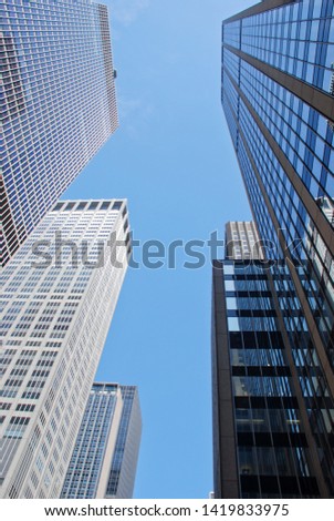 modern buildings in new york city on a clear blue sky