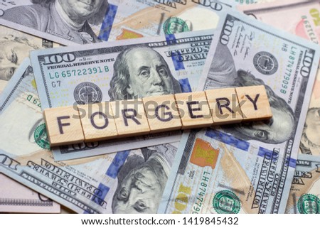 The word forgery on dollar usa background