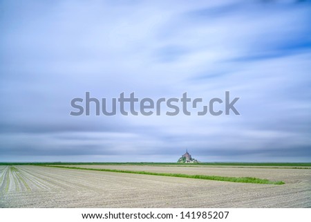 Mont Saint Michel monastery landmark and field. Unesco heritage site. Normandy, France, Europe. Long exposure photography