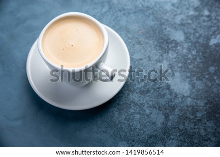 coffee on blue pastel color background. Top view. Flat lay style