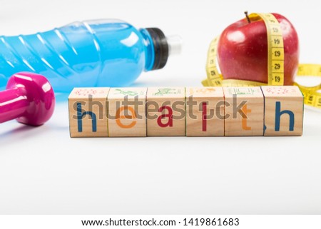 Mineral water,apple, tape measure heaviness for healthy life with sport.