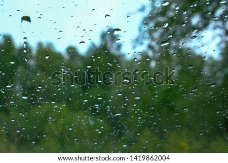 rain drops on window glass. view from inside out