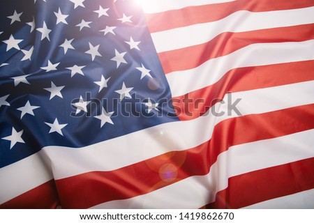 American flag waving in the wind.  Royalty-Free Stock Photo #1419862670