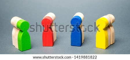 Groups of multicolored wooden people. The concept of market segmentation. Customer relationship management. Target audience, customer care. Groups of buyers. Targeting. Segments Royalty-Free Stock Photo #1419881822
