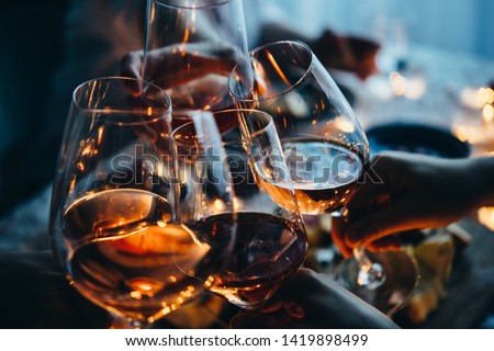 Glasses of wine seen during a friendly party of a celebration. Royalty-Free Stock Photo #1419898499