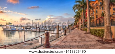 Sunset over the boats in Esplanade Harbor Marina in Marco Island, Florida Royalty-Free Stock Photo #1419925490