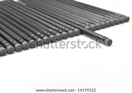black pencils on white background