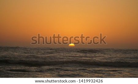 Sunset over the ocean near Walvis Bay, Namibia.