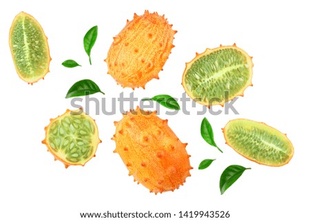 Kiwano or horned melon with leaves isolated on white background, Top view. Flat lay.