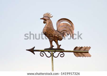 lose up of a Weather Vane Pointing towards the wind Royalty-Free Stock Photo #1419957326