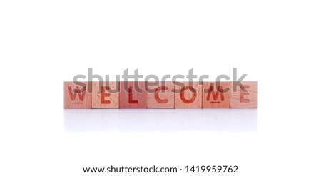wooden cube with word welcome on white background. Concept image