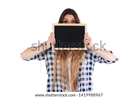 Portrait of young woman holding a chalkboard. Isolated white background
