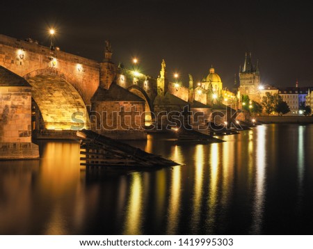 Night view of the Charles Bridge, Vltava River, Charles Bridge Tower and St. Francis Of Assisi Church in Prague, Czech Republic. Color temperature : 5300K(outdoors on a clear day)