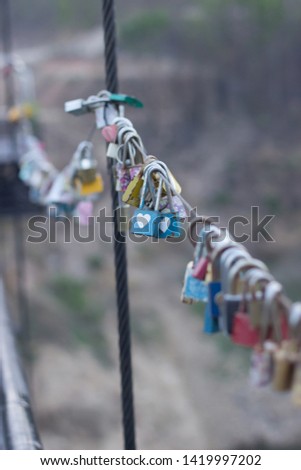The padlock hanging in pairs