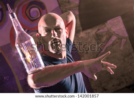Acrobatic Barman in Action - Freestyle american Bartender Royalty-Free Stock Photo #142001857