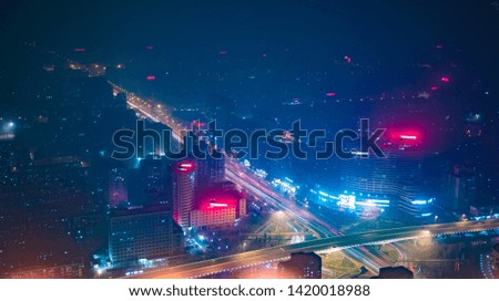 Beijing. Cityscape image of Beijing downtown during twilight blue hour. Abstract urban night light bokeh defocused background