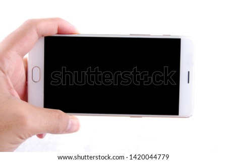 Man holding a white mobile phone with black screen isolated on white background