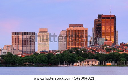 Boston Charles River sunset with urban skyline and skyscrapers