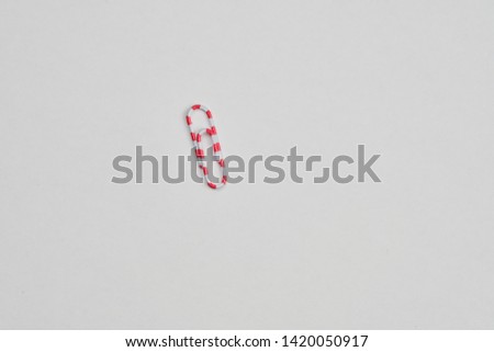 multicolored stationery paper clips close-up on white background