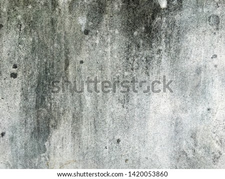 Concrete wall with black stains Used as a background image