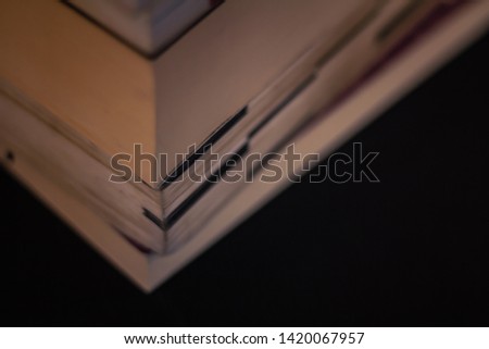 A stack of various books. 