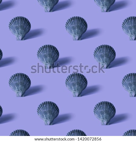 Seamless colorful pattern of shells on lilac color background. Conceptual modern trendy style. Minimal background