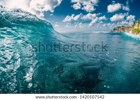 Blue barrel wave in ocean. Waves for surfing