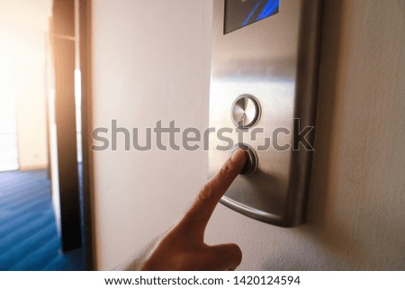Finger push Pointing up the elevator.