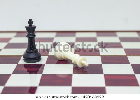 Business Competition Concept : Wooden chess pieces on chess board.