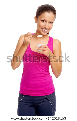 Healthy woman eating yoghurt isolated on white