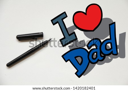 i love dad latter with pen on white background, top view