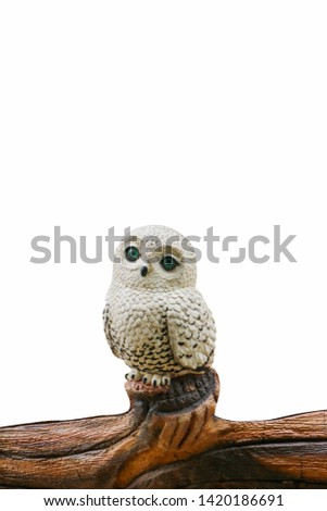 owl statue with a sad face  