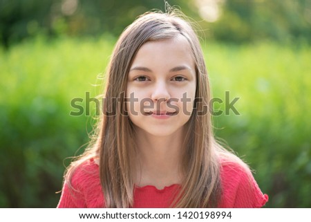 Portrait Of Beautiful Girl With Brown Hair Green Eyes Smiles