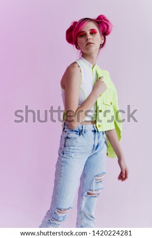 stylish woman with pink hair in jeans