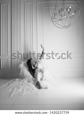 woman with angel wings in studio with white background,Horror background. Halloween background.