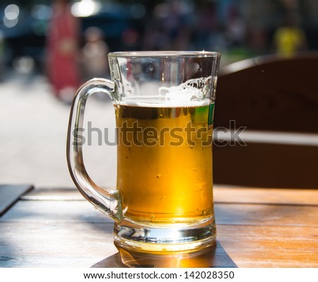 beer mugs close-up on wooden table