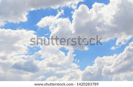 Background with blue sky and clouds.