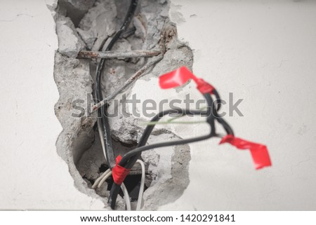 hole in the wall. bad wiring. insulation electricity. danger