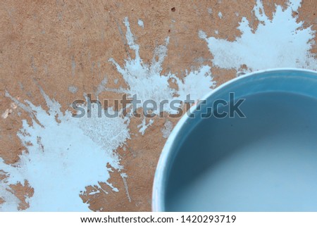 Six-tone blue water color on the concrete floor closely In painting sports fields, concrete floors with watercolors (blue) have roller conversion equipment and water colors.  