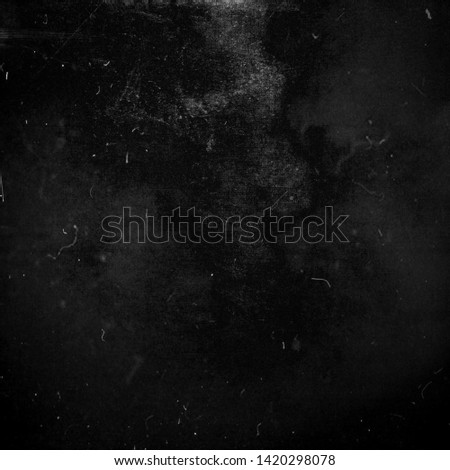 Black grunge scratched background, old film effect, scary distressed texture, copy space