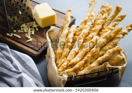 Cheese stick. Breadsticks with cheese on dark background, concept for snack or party time Royalty-Free Stock Photo #1420300406