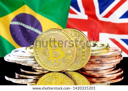Concept for investors in cryptocurrency and Blockchain technology in the Brazil and United Kingdom. Bitcoins on the background of the flag Brazil and UK.