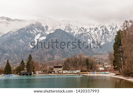 A view of Alps in Interlaken from one of the lakes as Interlaken means two lakes where they meet. In winter even, Interlaken is colorful. 
