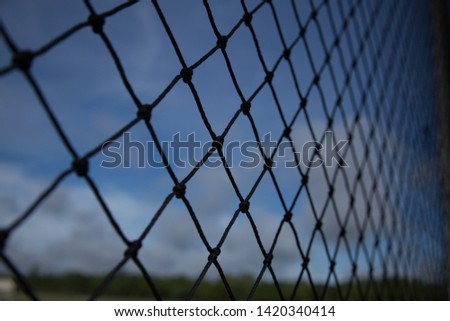 Black mesh at the football field.