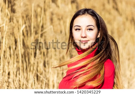 Portrait of a beautiful girl with flying hair. Stock photo stop motion frame of hair.