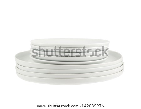 Accurate pile stack of the round ceramic white dish copyspace plates composition isolated over white background