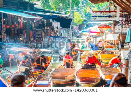 Damnoen Saduak Floating Market, tourists visiting by boat, located in Bangkok, Thailand. Royalty-Free Stock Photo #1420360301