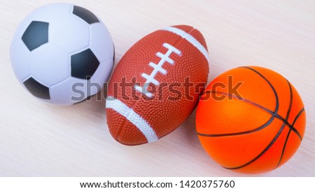 Balls for american football, basketball, soccer. lie on the green. Outdoor sports championship. Different types of games. copy space