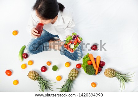 Asian woman drinking  juice on white background. Healthy food and Diet concept.