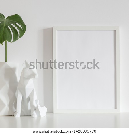 Monstera leaf and picture frame. 